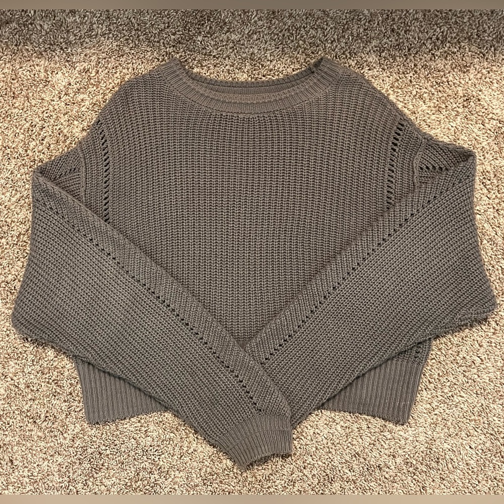 Oversized, grey sweater. Very comfortable.